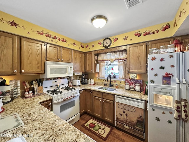 9 Sami Dr, Howell, NJ 07731 - kitchen featuring white appliances, brown cabinets, dark wood finished floors, and light stone counters