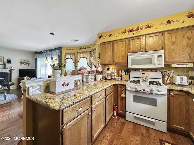 9 Sami Dr, Howell, NJ 07731 - kitchen with white appliances, a peninsula, open floor plan, dark wood-style floors, and brown cabinets