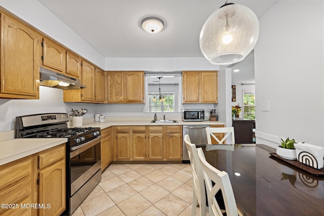 405 Hampton Ct Unit 15-4, Manalapan, NJ 07726 - kitchen featuring appliances with stainless steel finishes, under cabinet range hood, a sink, and light countertops