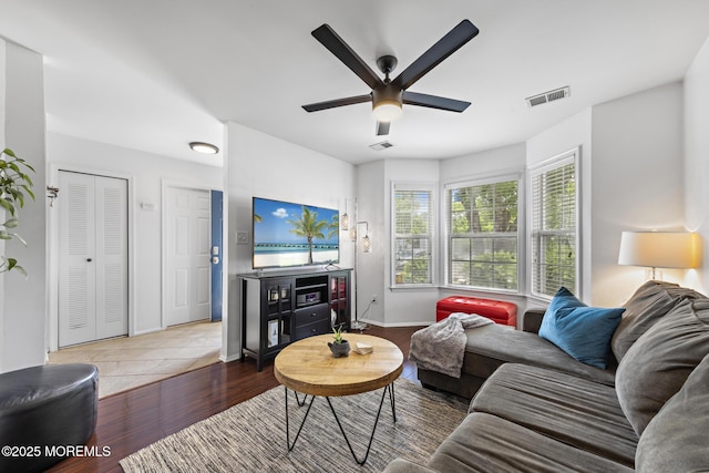 405 Hampton Ct Unit 15-4, Manalapan, NJ 07726 - living area with a ceiling fan, wood finished floors, and baseboards