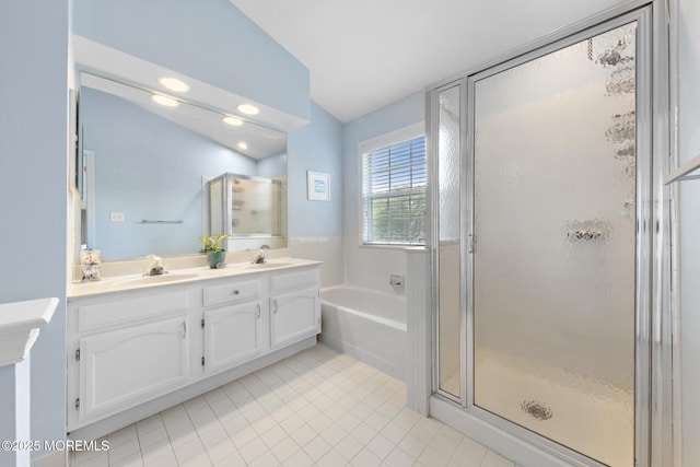 405 Hampton Ct Unit 15-4, Manalapan, NJ 07726 - full bath featuring double vanity, a shower stall, a bath, tile patterned flooring, and lofted ceiling