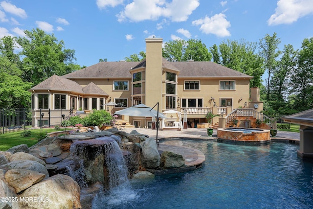 6 Bordens Brook Way, Holmdel, NJ 07733 - back of property with a chimney, stucco siding, a pool with connected hot tub, stairs, and a patio