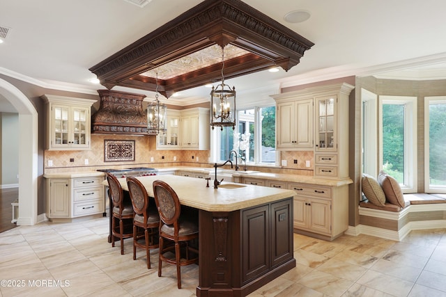 6 Bordens Brook Way, Holmdel, NJ 07733 - kitchen featuring cream cabinets, light countertops, crown molding, a sink, and premium range hood