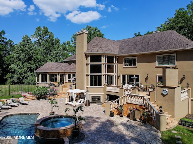 6 Bordens Brook Way, Holmdel, NJ 07733 - rear view of house featuring stucco siding, a patio, a chimney, and a shingled roof