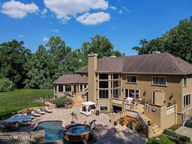 6 Bordens Brook Way, Holmdel, NJ 07733 - rear view of property featuring stairs, an in-ground hot tub, a patio area, a fenced backyard, and stucco siding