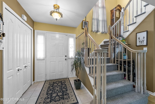 33 Oliver Ct Unit 1, Freehold, NJ 07728 - entrance foyer featuring stairway, baseboards, and tile patterned flooring