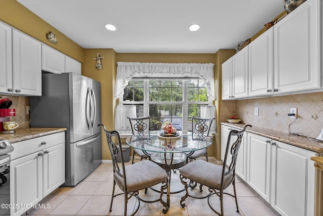 33 Oliver Ct Unit 1, Freehold, NJ 07728 - kitchen with light tile patterned flooring, white cabinets, appliances with stainless steel finishes, decorative backsplash, and recessed lighting