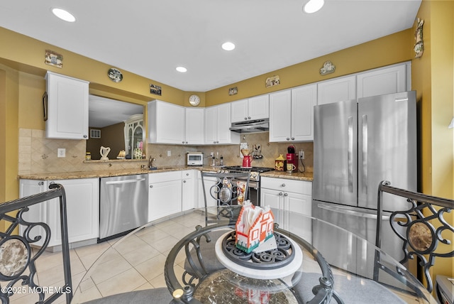 33 Oliver Ct Unit 1, Freehold, NJ 07728 - kitchen with stainless steel appliances, under cabinet range hood, white cabinets, decorative backsplash, and recessed lighting