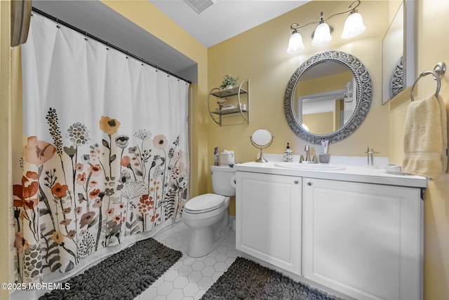 33 Oliver Ct Unit 1, Freehold, NJ 07728 - bathroom featuring toilet, vanity, tile patterned flooring, and a shower with curtain