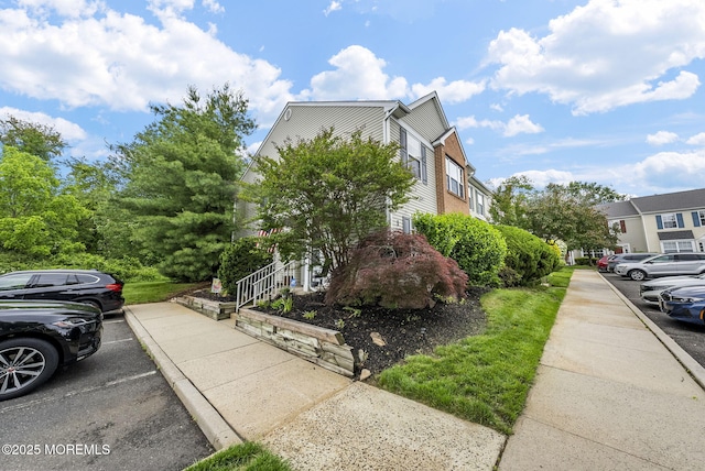 33 Oliver Ct Unit 1, Freehold, NJ 07728 - view of home's exterior with uncovered parking