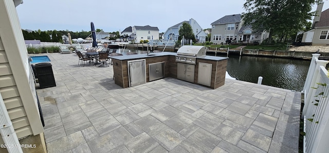 29 Longpoint Dr, Brick, NJ 08723 - view of patio featuring a water view, a residential view, a sink, and outdoor dining space