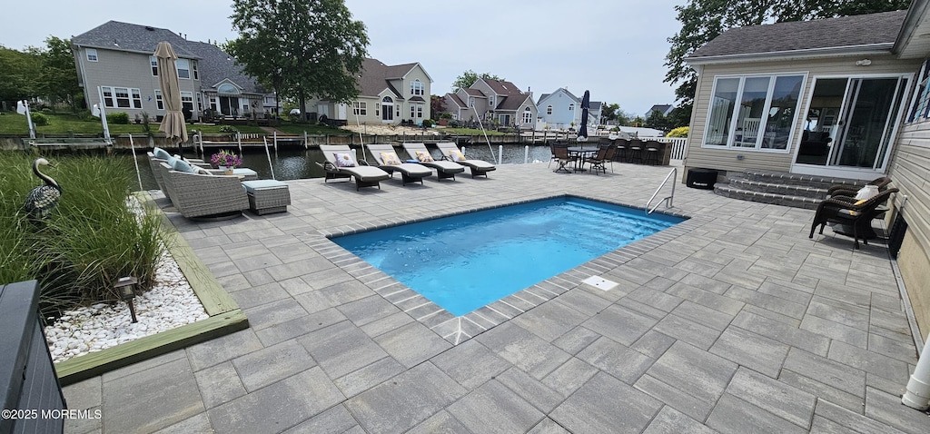 29 Longpoint Dr, Brick, NJ 08723 - view of swimming pool with a patio, a residential view, a water view, and an outdoor hangout area