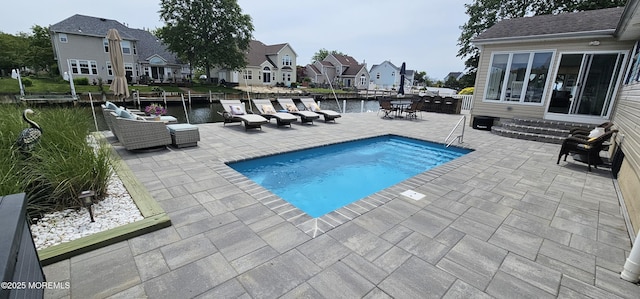 29 Longpoint Dr, Brick, NJ 08723 - view of swimming pool with a patio, a residential view, a water view, and an outdoor hangout area