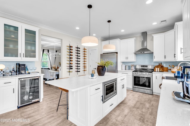 6 Harpoon Dr, Barnegat, NJ 08005 - kitchen with wall chimney exhaust hood, stainless steel appliances, wine cooler, light countertops, and recessed lighting