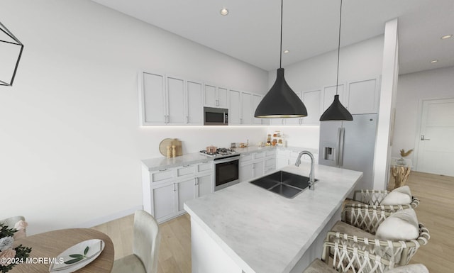 3 5th Ave Unit 208, Neptune City, NJ 07753 - kitchen featuring stainless steel appliances, a sink, light wood-style flooring, white cabinets, and a kitchen breakfast bar