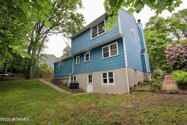 208 Hillcrest Ave, Neptune Township, NJ 07753 - rear view of property featuring a chimney, a yard, and cooling unit