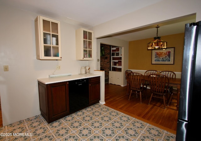 208 Hillcrest Ave, Neptune Township, NJ 07753 - kitchen featuring dishwasher, freestanding refrigerator, light countertops, glass insert cabinets, and light wood-type flooring