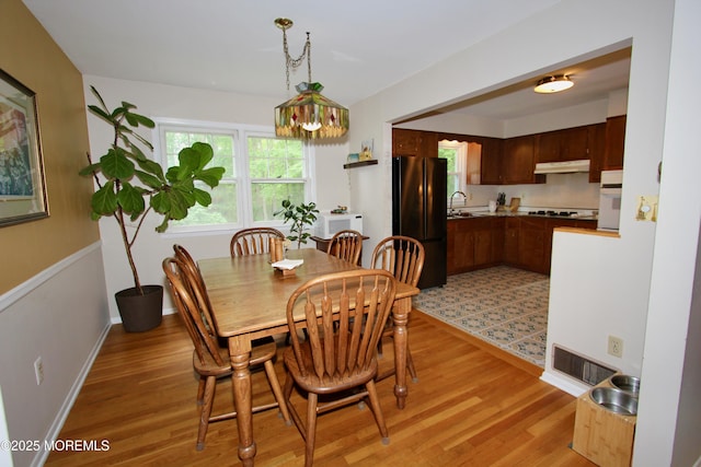 208 Hillcrest Ave, Neptune Township, NJ 07753 - dining space with light wood-type flooring and baseboards
