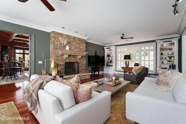 7 Stoney Brook Dr, Millstone, NJ 08510 - living room with ceiling fan, ornamental molding, wood finished floors, and a stone fireplace
