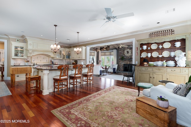 7 Stoney Brook Dr, Millstone, NJ 08510 - living room featuring ceiling fan, dark wood-type flooring, a chandelier, and ornamental molding