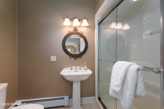 7 Stoney Brook Dr, Millstone, NJ 08510 - bathroom with toilet, wallpapered walls, a shower stall, a baseboard radiator, and a sink