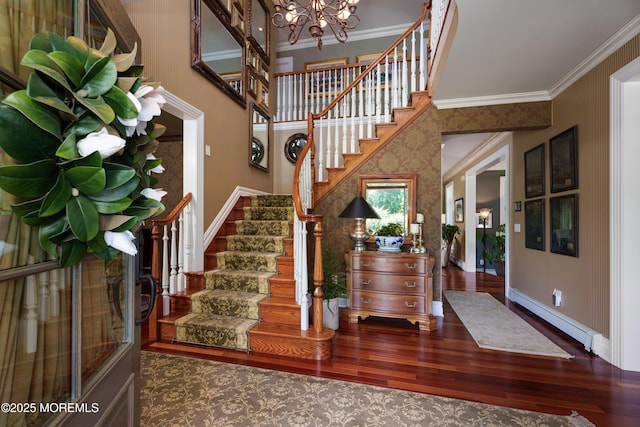 7 Stoney Brook Dr, Millstone, NJ 08510 - foyer entrance featuring ornamental molding, stairway, wood finished floors, a baseboard radiator, and baseboards