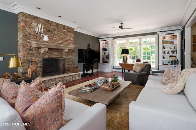 7 Stoney Brook Dr, Millstone, NJ 08510 - living area featuring a ceiling fan, ornamental molding, a stone fireplace, and wood finished floors