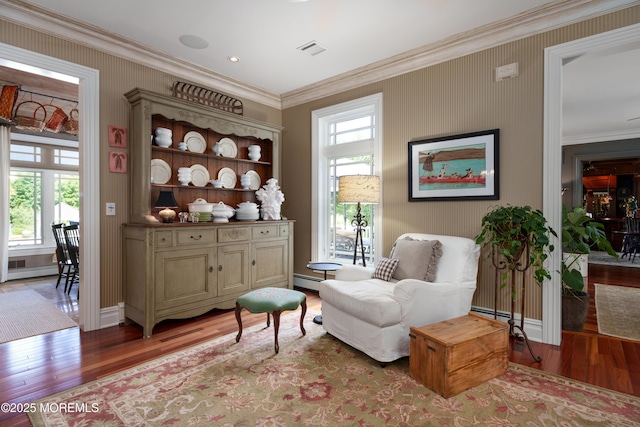 7 Stoney Brook Dr, Millstone, NJ 08510 - sitting room with wood finished floors, crown molding, plenty of natural light, and baseboard heating