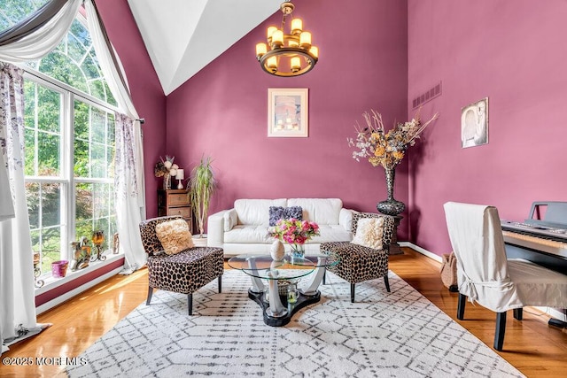 9 Kindling Way, Jackson, NJ 08527 - living room featuring a chandelier, high vaulted ceiling, baseboards, and wood finished floors