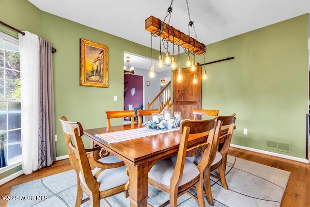 9 Kindling Way, Jackson, NJ 08527 - dining room featuring wood finished floors, stairs, baseboards, and a chandelier