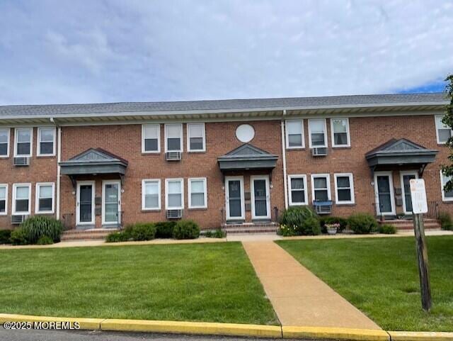 310 Maryland Ave Unit 11B, Point Pleasant Beach, NJ 08742 - view of property with brick siding, a front lawn, and cooling unit