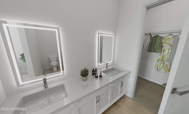 3 5th Ave Unit 104, Neptune City, NJ 07753 - bathroom with double vanity, toilet, and wood finished floors