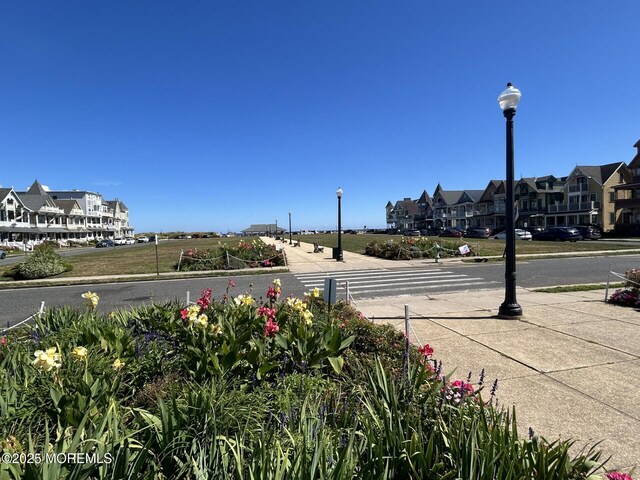 3 5th Ave Unit 104, Neptune City, NJ 07753 - view of street with street lights, sidewalks, curbs, and a residential view