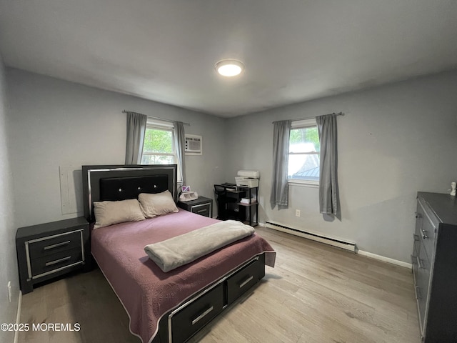 442 Bay Way, Lanoka Harbor, NJ 08734 - bedroom with baseboard heating, light wood-style flooring, baseboards, and a wall mounted AC