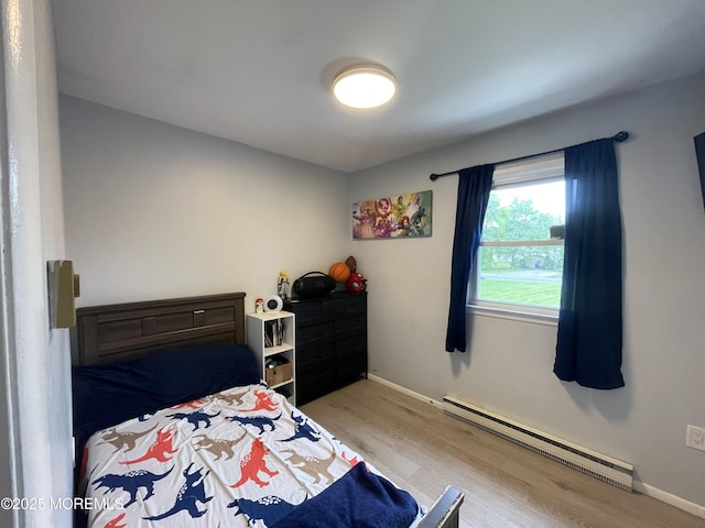 442 Bay Way, Lanoka Harbor, NJ 08734 - bedroom with a baseboard radiator, light wood-style flooring, and baseboards