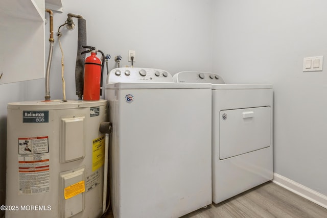 442 Bay Way, Lanoka Harbor, NJ 08734 - laundry area with water heater, independent washer and dryer, wood finished floors, and baseboards