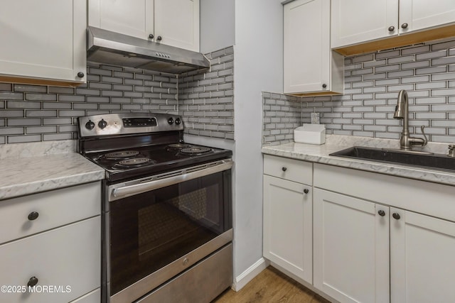 442 Bay Way, Lanoka Harbor, NJ 08734 - kitchen with electric stove, under cabinet range hood, a sink, backsplash, and white cabinets
