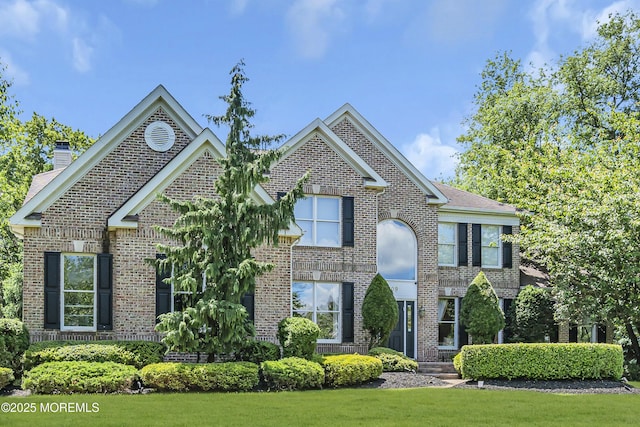 209 Shepard Way, Manalapan, NJ 07726 - traditional-style house with brick siding and a chimney
