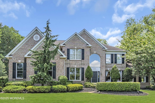 209 Shepard Way, Manalapan, NJ 07726 - view of front of home with brick siding and a front yard