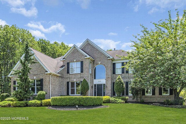 209 Shepard Way, Manalapan, NJ 07726 - view of front of home with brick siding and a front lawn