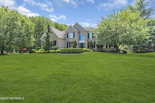 209 Shepard Way, Manalapan, NJ 07726 - view of front of home featuring a front yard and brick siding
