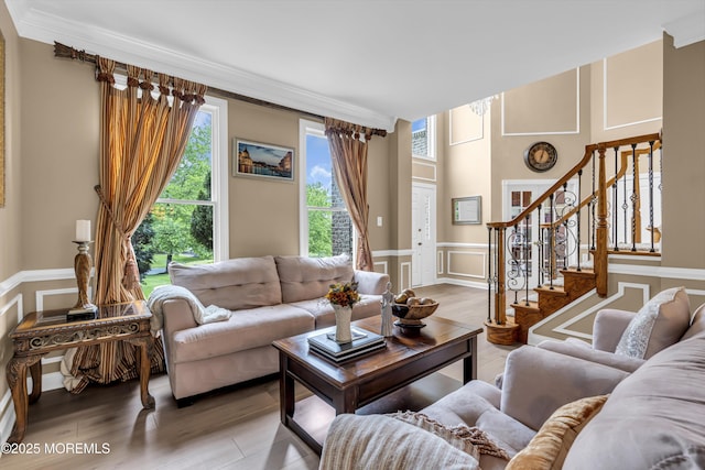 209 Shepard Way, Manalapan, NJ 07726 - living room with a decorative wall, plenty of natural light, stairs, ornamental molding, and a wainscoted wall