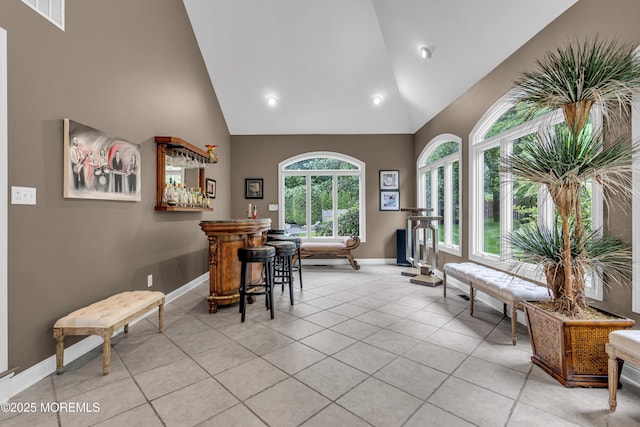 209 Shepard Way, Manalapan, NJ 07726 - dining space featuring high vaulted ceiling, baseboards, a bar, light tile patterned flooring, and recessed lighting