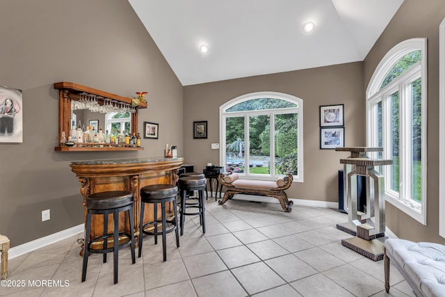 209 Shepard Way, Manalapan, NJ 07726 - indoor dry bar featuring high vaulted ceiling, healthy amount of natural light, baseboards, light tile patterned flooring, and recessed lighting