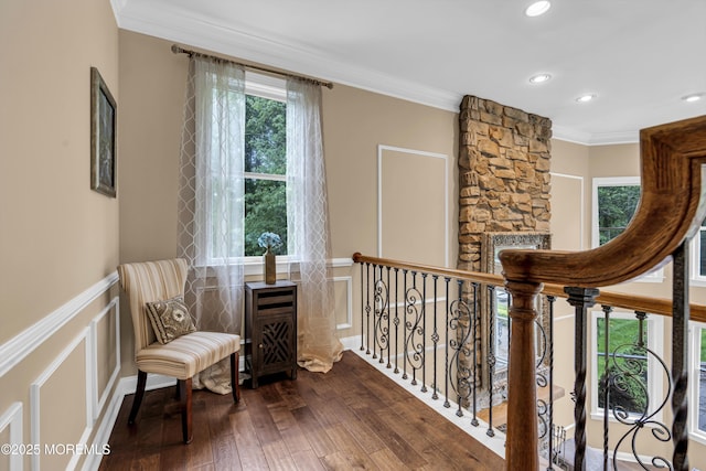 209 Shepard Way, Manalapan, NJ 07726 - living area with hardwood / wood-style flooring, crown molding, a decorative wall, recessed lighting, and a wainscoted wall