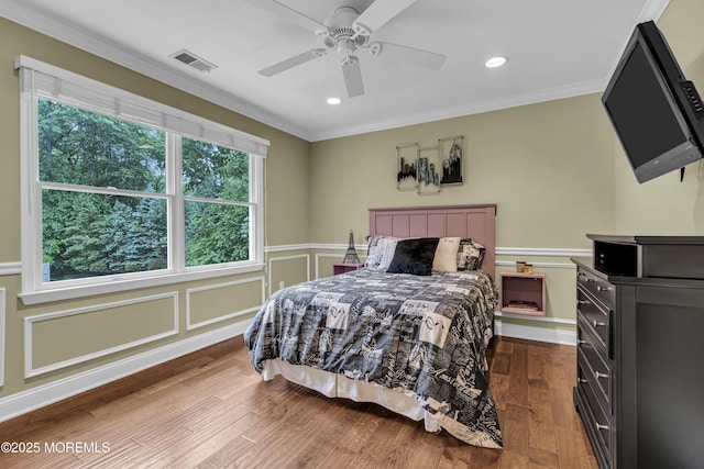 209 Shepard Way, Manalapan, NJ 07726 - bedroom featuring ornamental molding, multiple windows, a wainscoted wall, recessed lighting, and wood finished floors