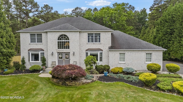 6 Overlook Dr, Jackson, NJ 08527 - georgian-style home featuring brick siding, a front lawn, and a shingled roof
