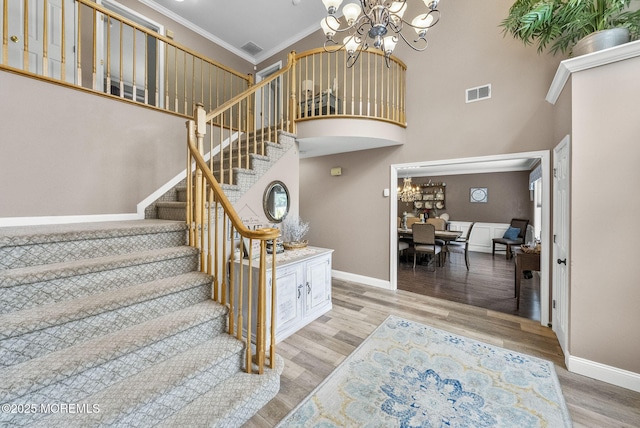 6 Overlook Dr, Jackson, NJ 08527 - stairway featuring a chandelier, baseboards, a towering ceiling, ornamental molding, and wood finished floors
