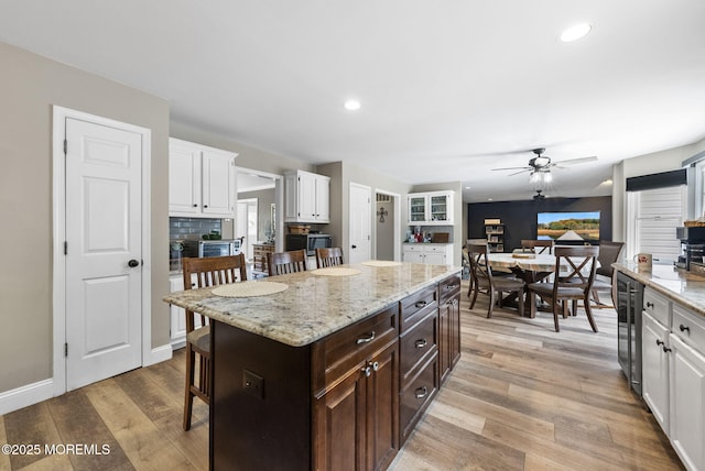 6 Overlook Dr, Jackson, NJ 08527 - kitchen featuring a kitchen bar, a ceiling fan, white cabinets, light wood-type flooring, and dark brown cabinetry