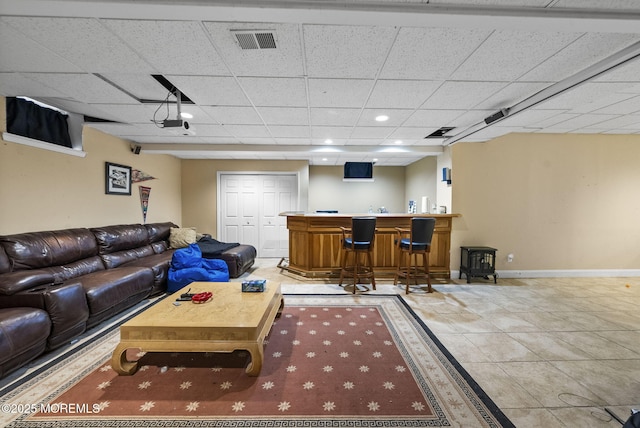 6 Overlook Dr, Jackson, NJ 08527 - living room with bar area, baseboards, a drop ceiling, and light tile patterned flooring